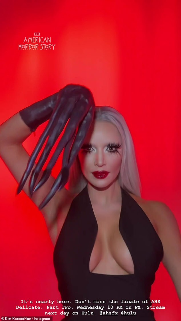 She posed in the costume's gloves, as well as an icy platinum blonde wig, a deep red lip, and fake spider eyelashes.