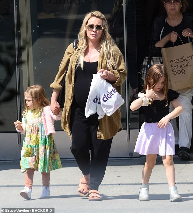 The Lizzie McGuire alum, 36, was seen holding hands with her little ones as they left the Claires jewelry and accessories store in the Sherman Oaks shopping center.