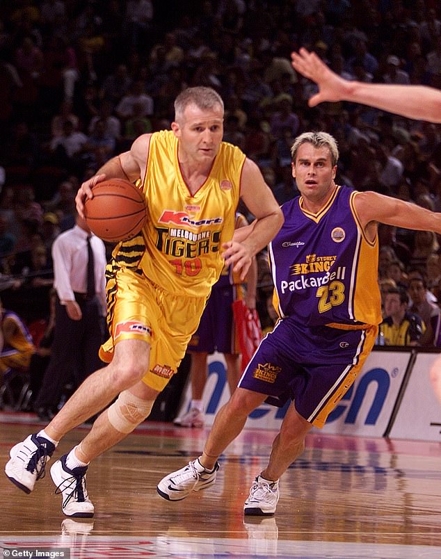 Heal, pictured right guarding Australian basketball legend Andrew Gaze, claimed he was suspended for exercising certain rights in the workplace.