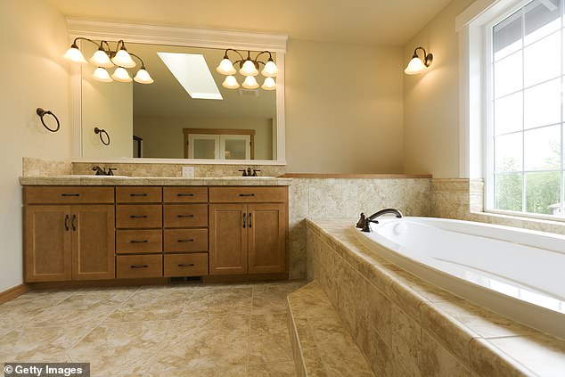 Travertine is a common and desirable material for home tiles. It is cheaper than marble and its veins of calcite crystals give it an interesting appearance.