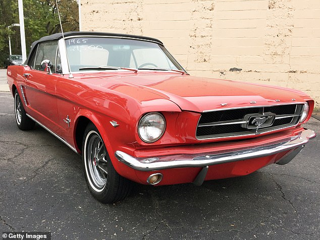 The scammer also put the stolen money into sports memorabilia and a 1965 Mustang (seen in a file image).
