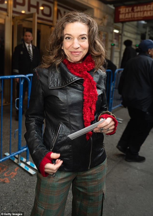 Singer-songwriter Ani DiFranco flashed a smile as she arrived.