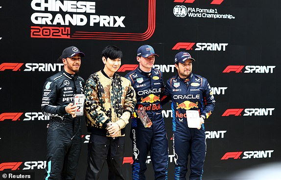 Formula One F1 - Chinese Grand Prix - Shanghai International Circuit, Shanghai, China - April 20, 2024 Singaporean singer JJ Lin poses with Max Verstappen of Red Bull, Sergio Perez and Lewis Hamilton of Mercedes after sprint REUTERS/Edgar Su