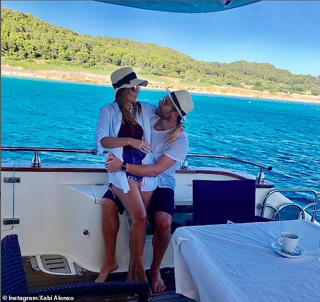 Xabi and his wife on board a boat during one of their holidays away from football