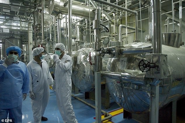 The Isfahan nuclear center stores some of Tehran's highly enriched uranium.  (Above) Technicians from the International Atomic Energy Agency inspect the site of the Isfahan uranium conversion plant in February 2007