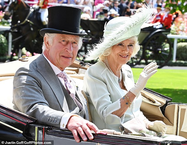 King Charles and Queen Camilla smile as they arrive at Royal Ascot on June 22, 2023.
