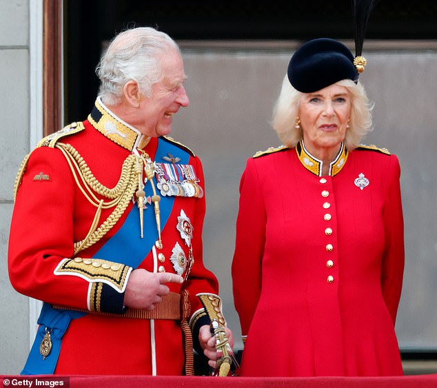 King Charles III and Queen Camilla (Colonel in the Grenadier Guards) watch an RAF flyover from the balcony of Buckingham Palace during Trooping the Color last year.