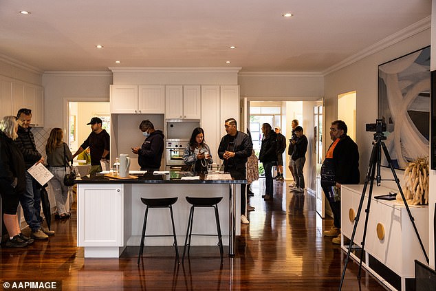 Giddings said the low number of houses being built in Australia is one of the main reasons rents are rising so much (pictured, people at an auction).