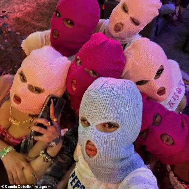 Another snap included in the post showed Camila wearing a light blue mask while posing with others wearing similar pieces.