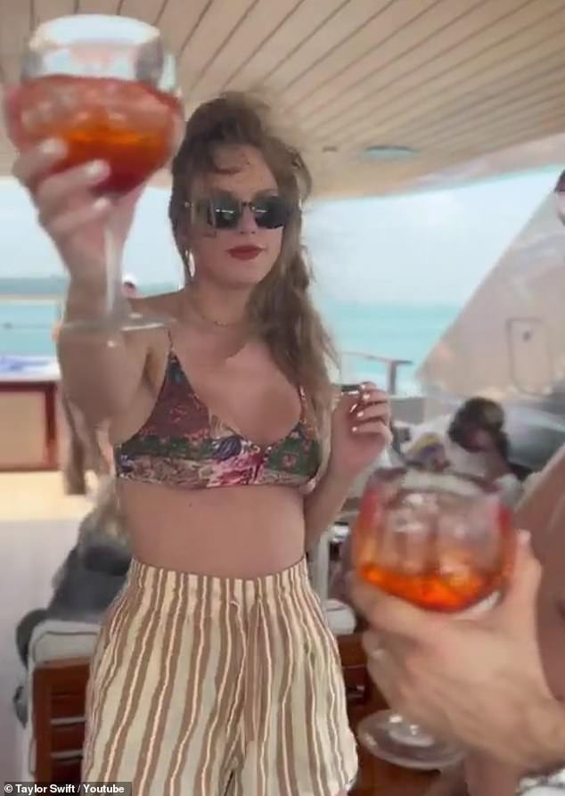 Will you join the singer's 14-day video challenge?  To mark the release of the Fortnight video, the singer also shared on YouTube Shorts 14 short video clips from her life over the past two weeks, including one of her enjoying a cocktail (pictured).