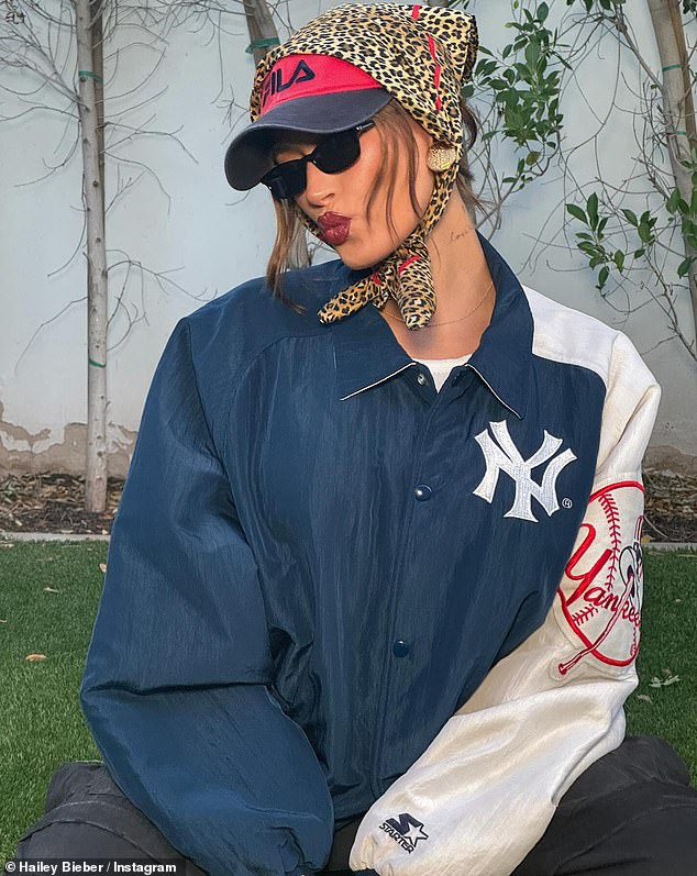 The Rhode Skin founder also shared a snap showing one of her Coachella looks from the opening weekend.  In the image of her, she was wearing a New York Yankees varsity jacket and sporting another red FILA cap with a dark visor, as well as a leopard print bandana around her head.