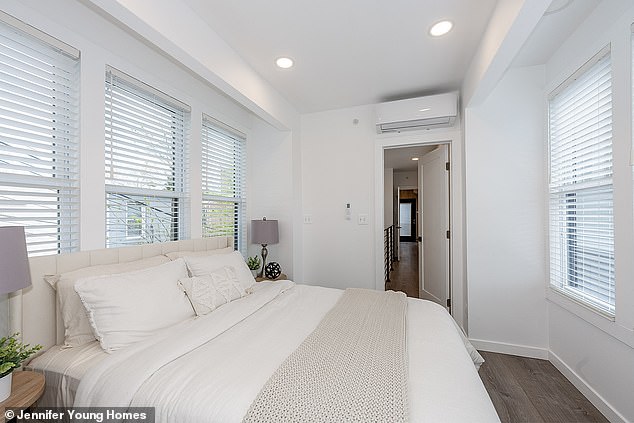 In the bedroom, there is a comfortable queen-size bed and ample closet space on clean white walls.