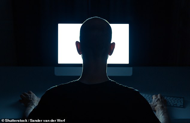 The Australian Government's Scam Watch tells Australians there are common signs of a scam to look out for, including when someone asks them to set up a new account or PAYID (pictured, a man on a computer, not a scammer) .