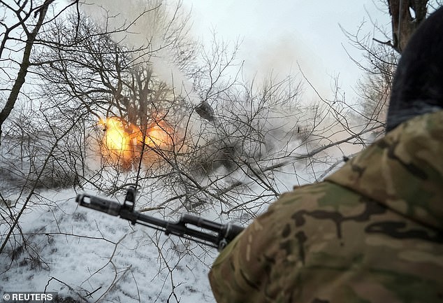 Ukrainian servicemen of the 93rd brigade fire a 2S1 Gvozdika self-propelled howitzer towards Russian troops