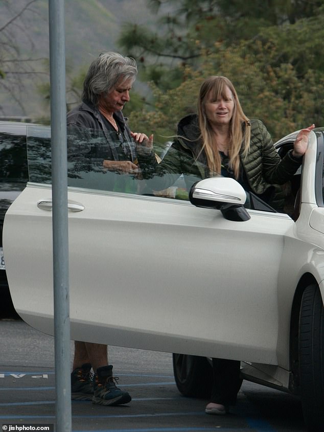 The singer parked his white Mercedes in a disabled space right in front with his sign hanging in the rearview mirror.