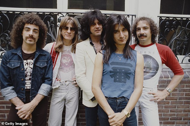 Perry was the rock band's lead singer during their most commercially successful periods from 1977 to 1987, and again from 1995 to 1998, and provided the signature vocals for the hits Don't Stop Believin' and Open Arms. The band is pictured in June 1979.