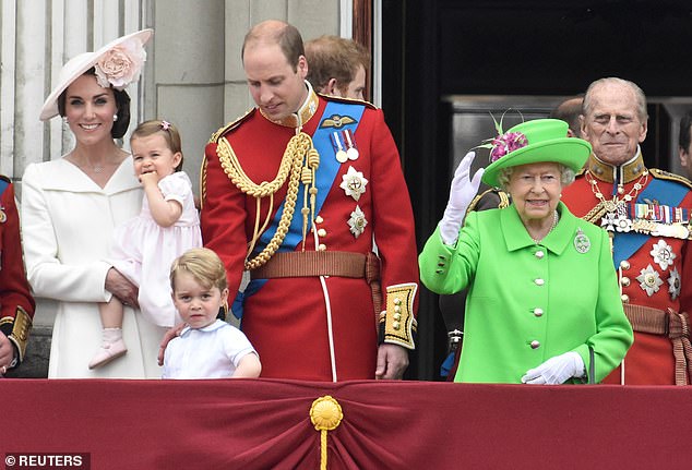 Queen Elizabeth and her husband Prince Philip, who died a year before her, are pictured during Trooping the Color in 2016 with Kate, William, Charlotte and George.