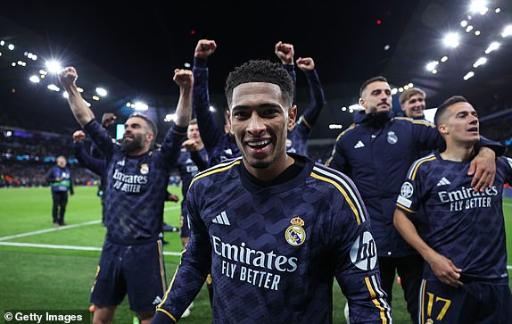 MANCHESTER, ENGLAND – APRIL 17: Jude Bellingham of Real Madrid celebrates with his teammates after the UEFA Champions League quarter-final second leg match between Manchester City and Real Madrid CF at the Etihad Stadium on April 17 April 2024 in Manchester, England. (Photo by Alex Livesey - Danehouse/Getty Images)