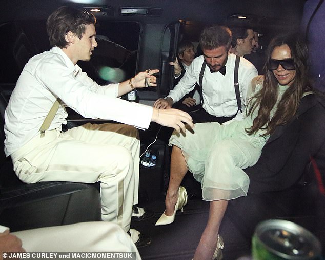 The Beckham family gets into a car to return home at the end of the night