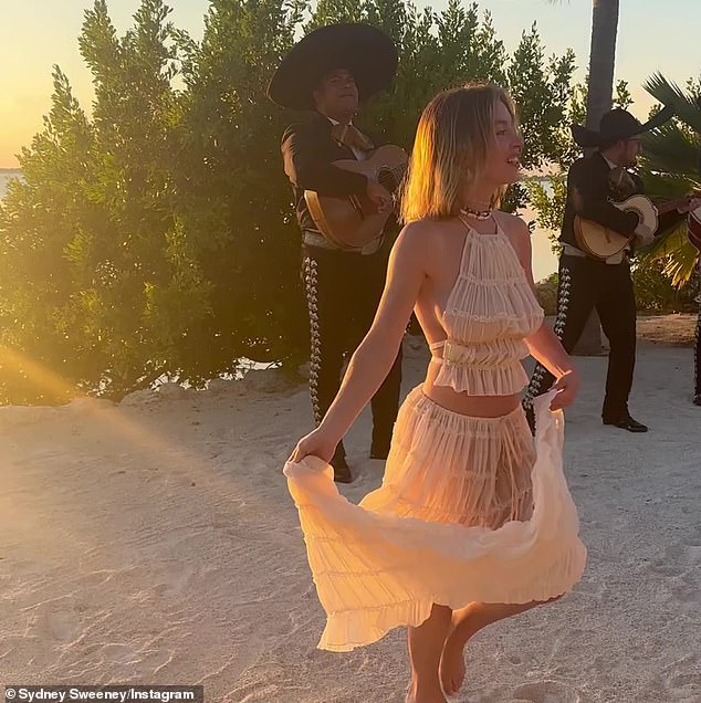 The Spokane-born, Los Angeles-raised bombshell shared a video of herself dancing barefoot on the beach while wearing a nude sleeveless top and matching long skirt.