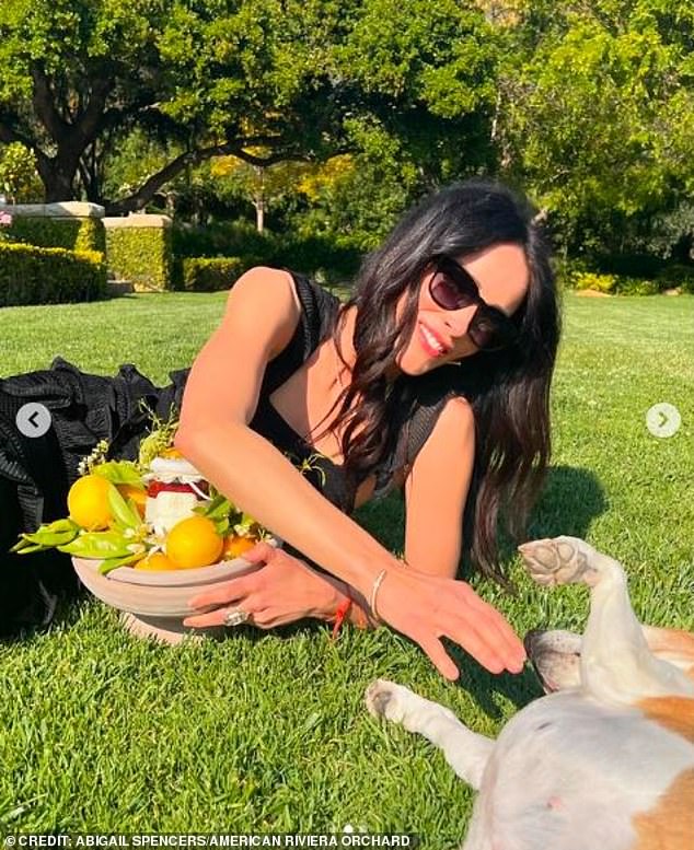 Smiling in a sunny garden with her dog, the Grey's Anatomy star showed off the ceramic bowl for all to see.
