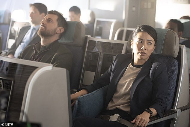 Jing Lusi (right) plays Metropolitan Police DC Hana Li, tasked with keeping our hero handcuffed during the flight. 