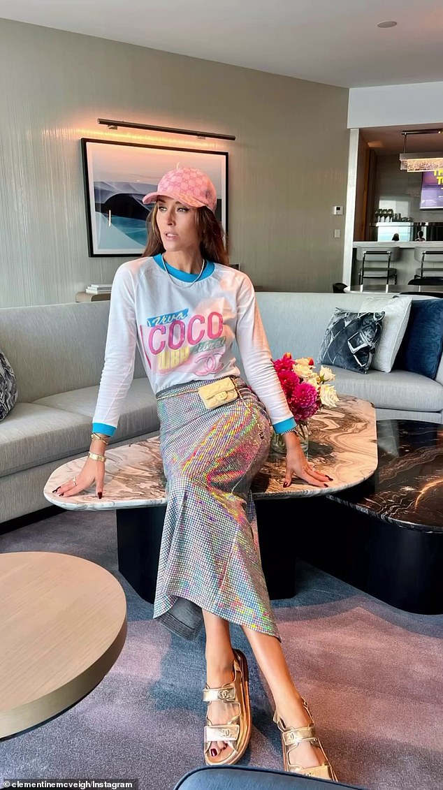 The model wore a Chanel long-sleeved T-shirt from the brand's Cruise 2017 collection paired with a spectacular Manning Cartell skirt.  She completed the look with a $750 pink Gucci baseball cap, a $5,500 Chanel mini flap fanny pack, and Chanel leather sandals worth a staggering $6,716.