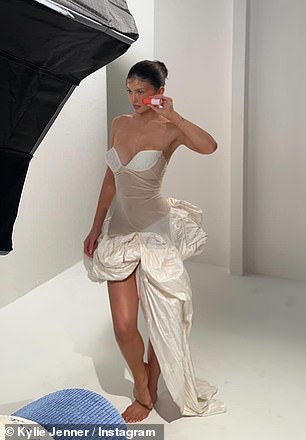 In one image, Kylie could be seen wearing a strapless corset dress with an asymmetrical skirt.
