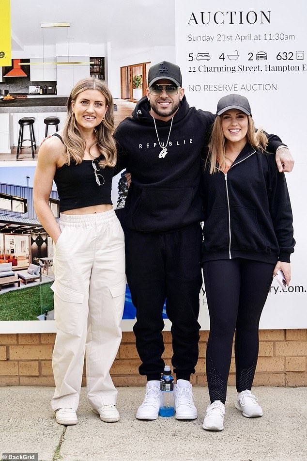 The high-profile businessman sold the house for $3.2 million during an auction on Sunday, at a loss of $1.1 million. In the photo Adrian with Eliza and Liberty.