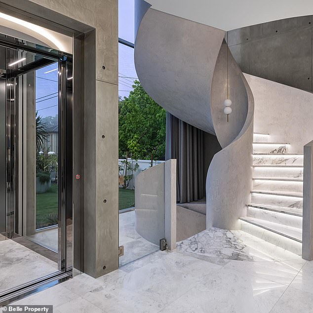 The luxury home features five bedrooms and six bathrooms, featuring concrete, Italian marble, European oak, travertine and limestone (pictured).