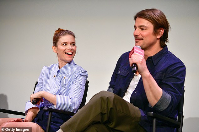 Kate smiled as Josh spoke on stage during the event.