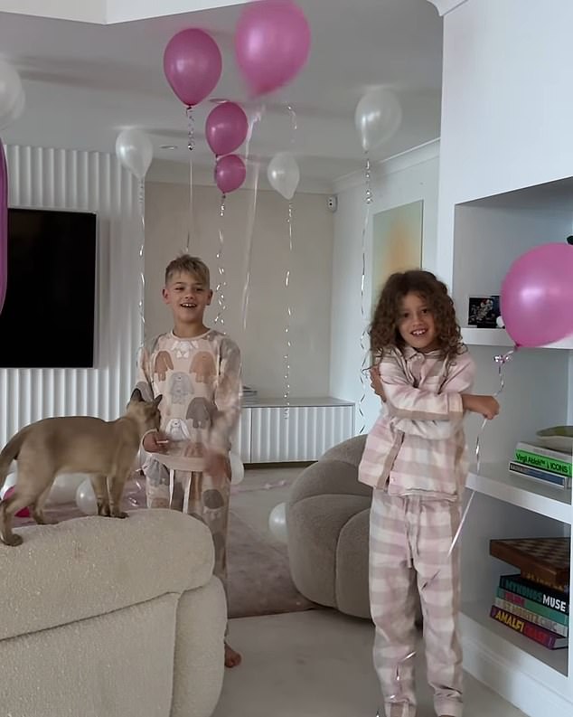 Tammy's children Wolf, eight, (left), Saskia, six, (right) and Posy, one, joined forces to surprise their doting mother by putting up the decorations.