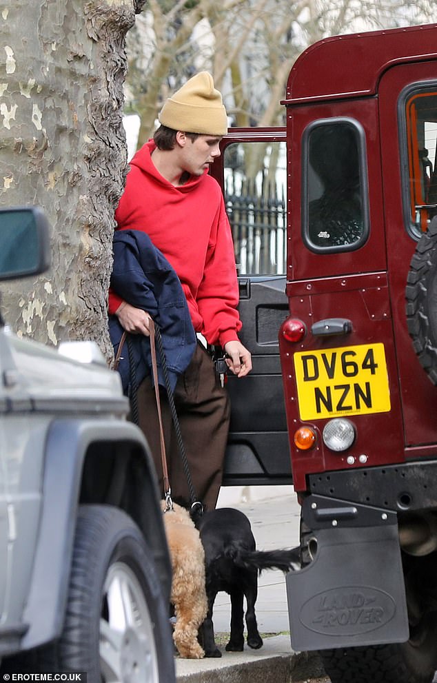 After partying on Saturday night, Cruz was spotted in London taking his beloved dogs for a walk while wearing casual clothes.