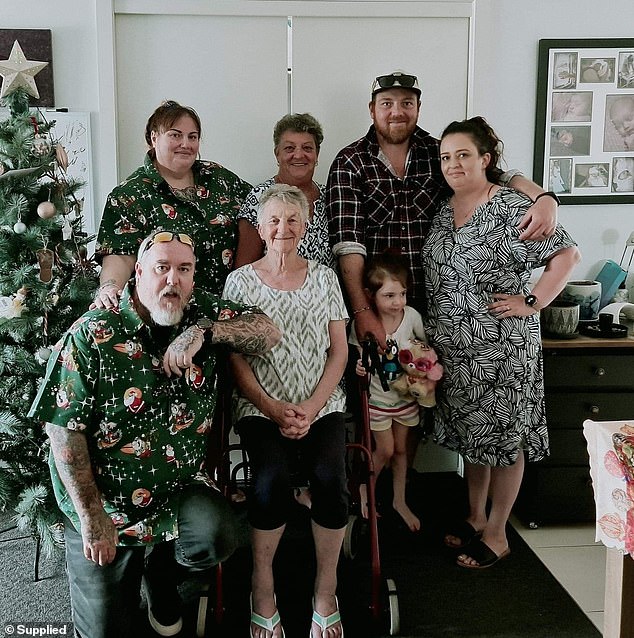 Pictured: The Figg family last Christmas: Robyn's daughter Daisy and her partner Ian (far left), Mrs Figg (centre back) and her mother Betty (centre front), son Josh, wife Liz , his daughter Grace (right).