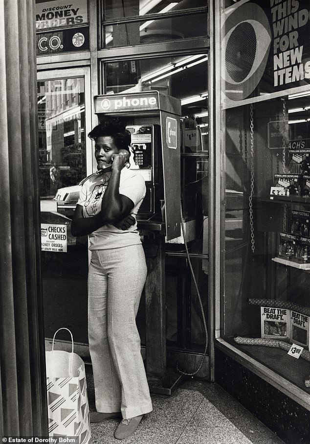 A woman using a pay phone in New York in the 1970s, when Bohm was happily married