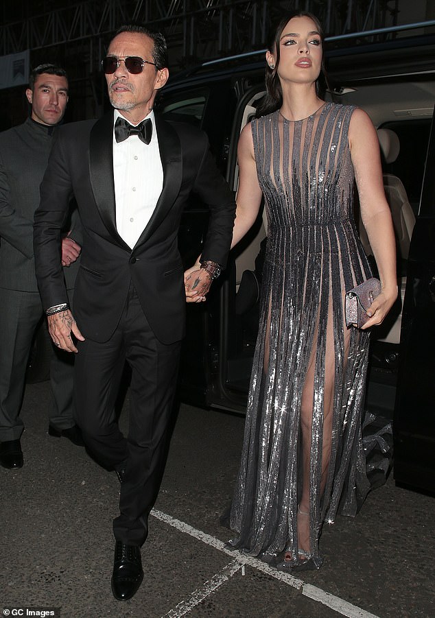 Marc Anthony and his wife Nadia Ferreira arrive at Victoria's 50th birthday party