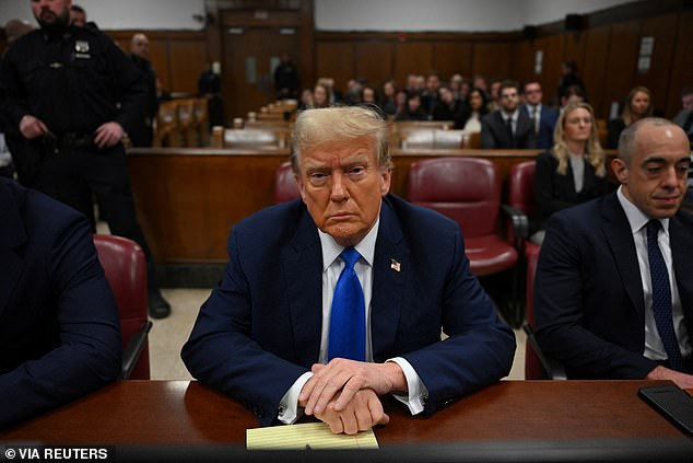 Former US President and Republican presidential candidate Donald Trump takes a seat in Manhattan Criminal Court during his trial for allegedly covering up money payments linked to extramarital affairs in New York, United States, on April 22, 2024.