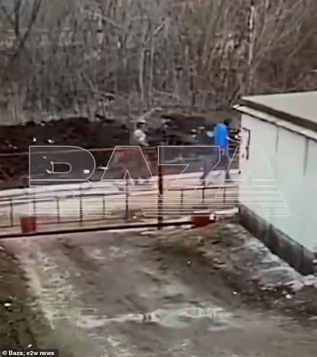 Khammatov is seen dressed in blue in a video of troops taking him away.