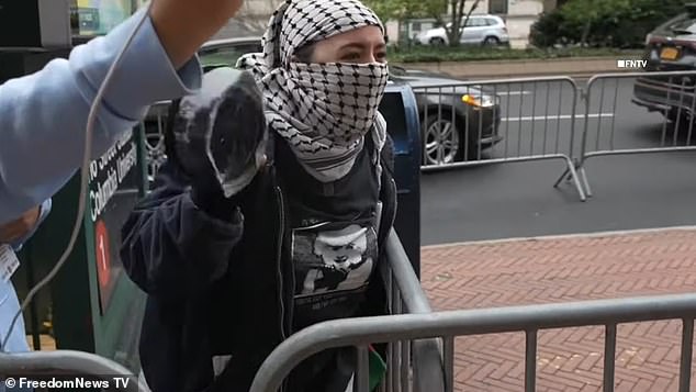 A video from last week shows pro-Palestinian and pro-Israeli protesters clashing outside the school as a woman shouts: 'We are Hamas!'