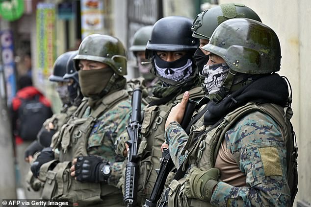 Soldiers supporting police forces stand guard in front of the El Inca prison in Quito on January 8, 2024.