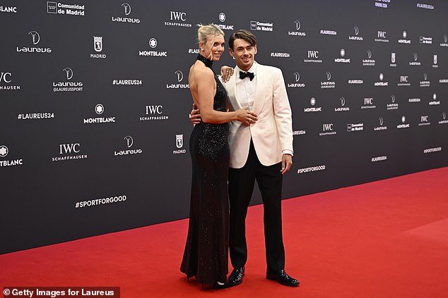 Katie was accompanied by her partner Alex de Minaur who wore a white jacket suit.