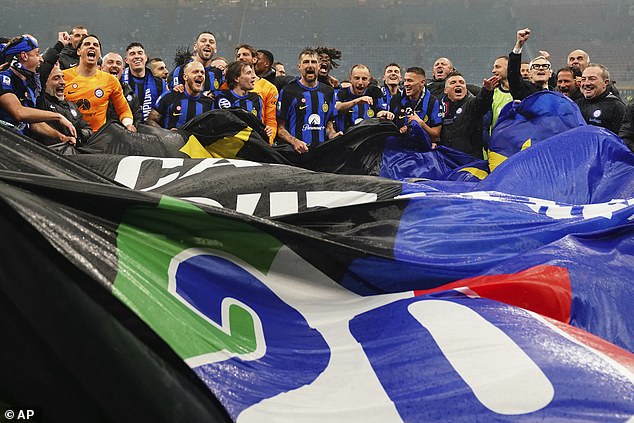 Inter Milan players and staff brought out banners with the number 20 to celebrate their victory, which puts them one title ahead of AC Milan's 19.