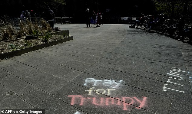 "Pray for Trumpy" is written on a sidewalk in front of Manhattan Criminal Court