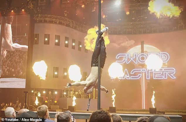 He rode a motorcycle onto the stage, ripped off his shirt, swallowed a sword and slid down a 40-foot pole as flames erupted behind him.