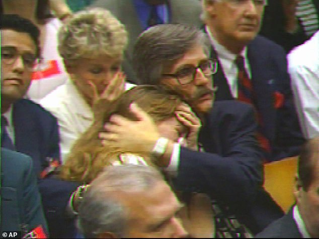 Ronald Goldman's father Fred hugged his daughter Kim as the verdicts were read.  Fred said that Simpson's death 