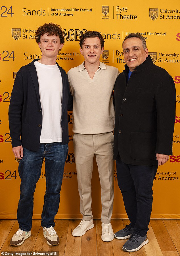 As the brothers smiled in the snaps, they were also joined by Tom's Marvel head Joe Russo.