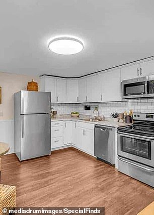 The first floor offers an eat-in kitchen equipped with stainless steel appliances.