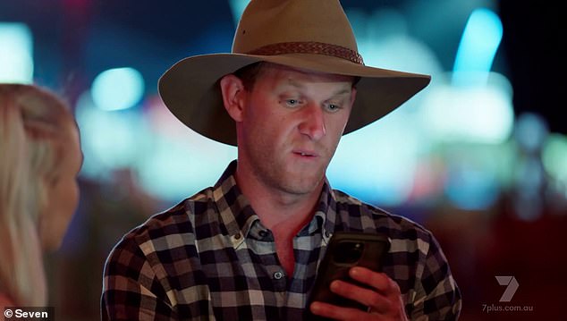 The scandal broke on Sunday's episode of Farmer Wants A Wife.  Farmer Dean (pictured) was forced to confront his love interest Teegan after receiving an explosive anonymous text message.