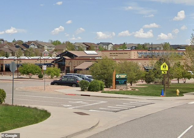 He was caught on camera walking into a field at Black Forest Hills Elementary School (pictured) in Aurora, Colorado.