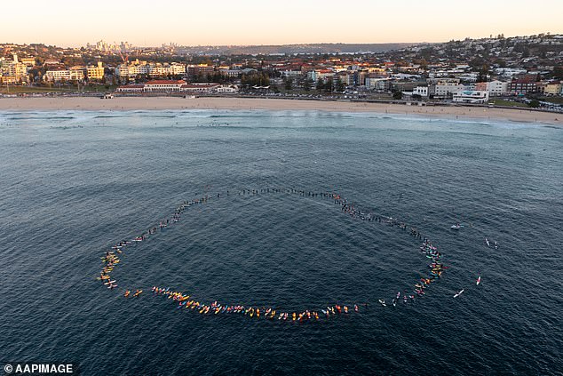 Surfers united in mourning to pay tribute to those lost in their local communities (pictured)